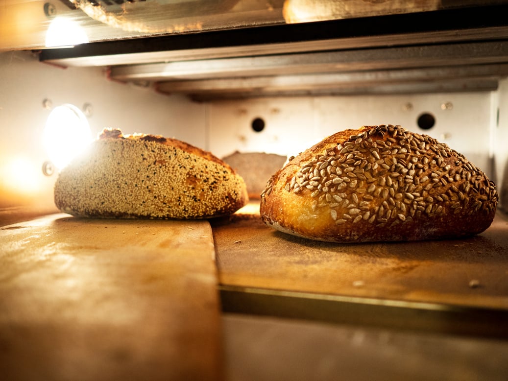 bread baking in the oven,Turkish breads at the exit from the oven after cooking, Sourdough Bread in a Burning oven, Sourdough bread in the oven,